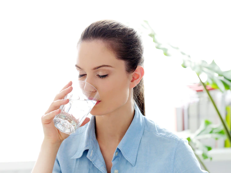 Girl Drinking water to prevent t a Hemorrhoid